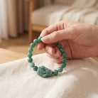 Hand Holding Natural Green Jade Bracelet Lifestyle Shot Chakra Calming Crystal Jewelry Photography"